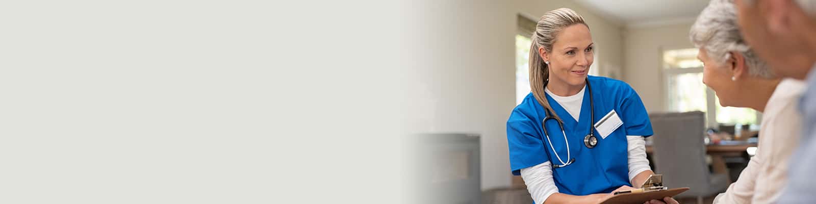 A nurse helping elderly residents